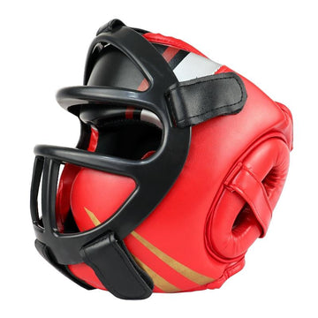 Red boxing headgear with black face guard on a white background