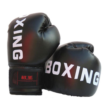 Black boxing gloves with 'BOXING' written on them on a white background