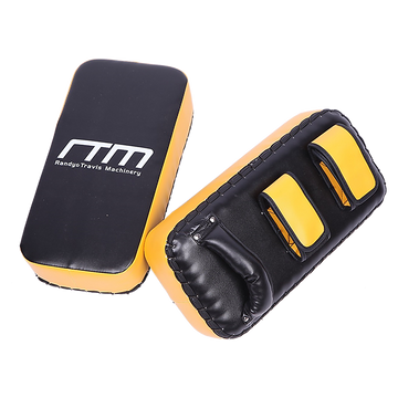 Black and yellow boxing pads with 'RTM' branding on a white background