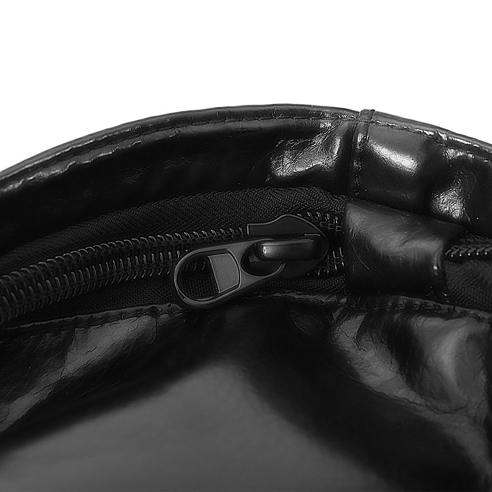 Close-up of a black leather bag with a zipper on a white background