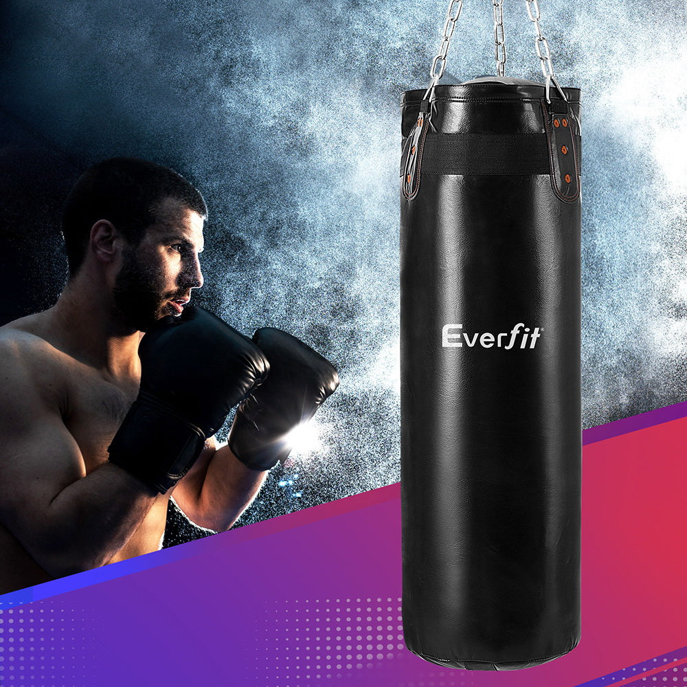 Man in boxing gloves preparing to punch a black Everfit punching bag against a colorful background.