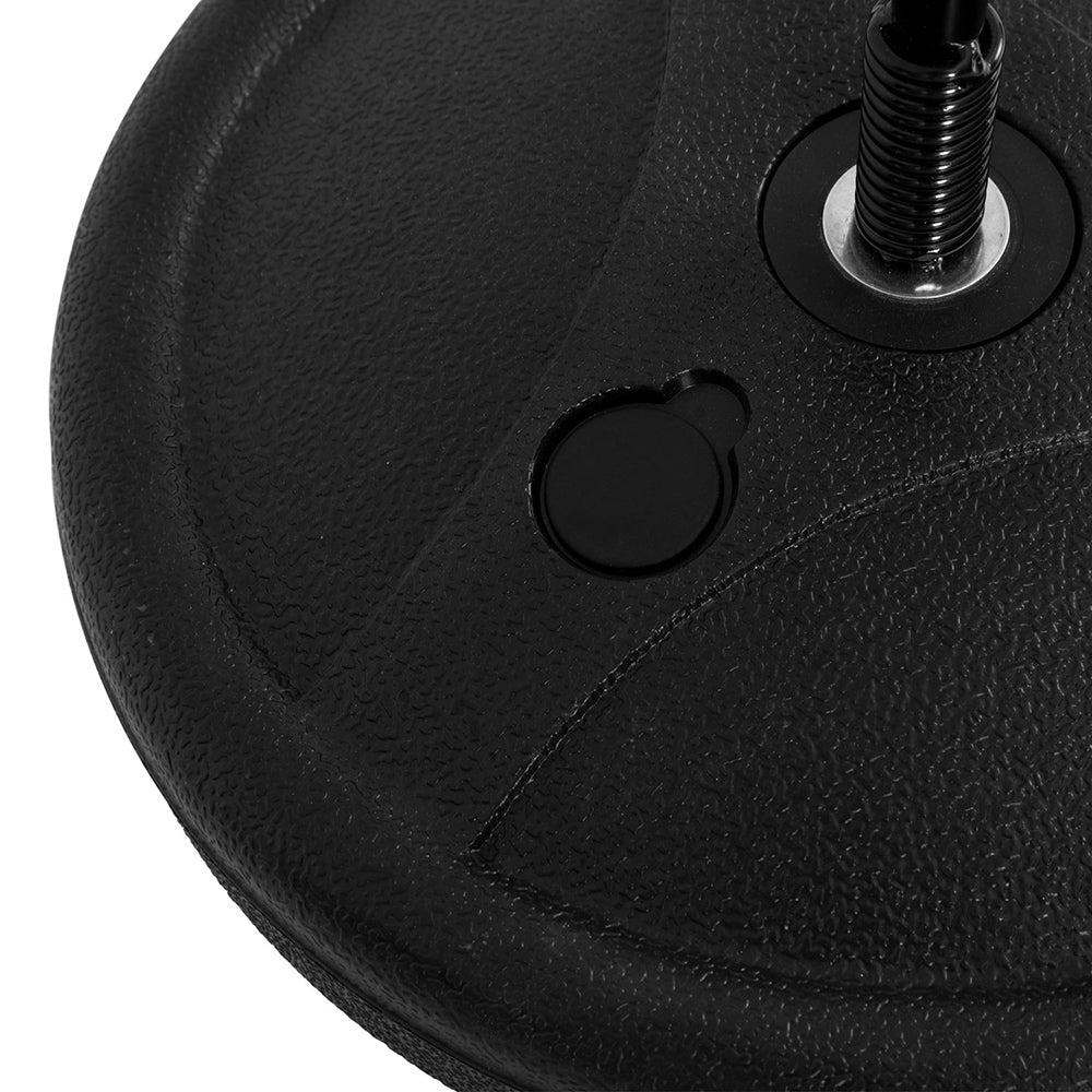 Close-up of a black rubber wheel with a metal axle on a white background