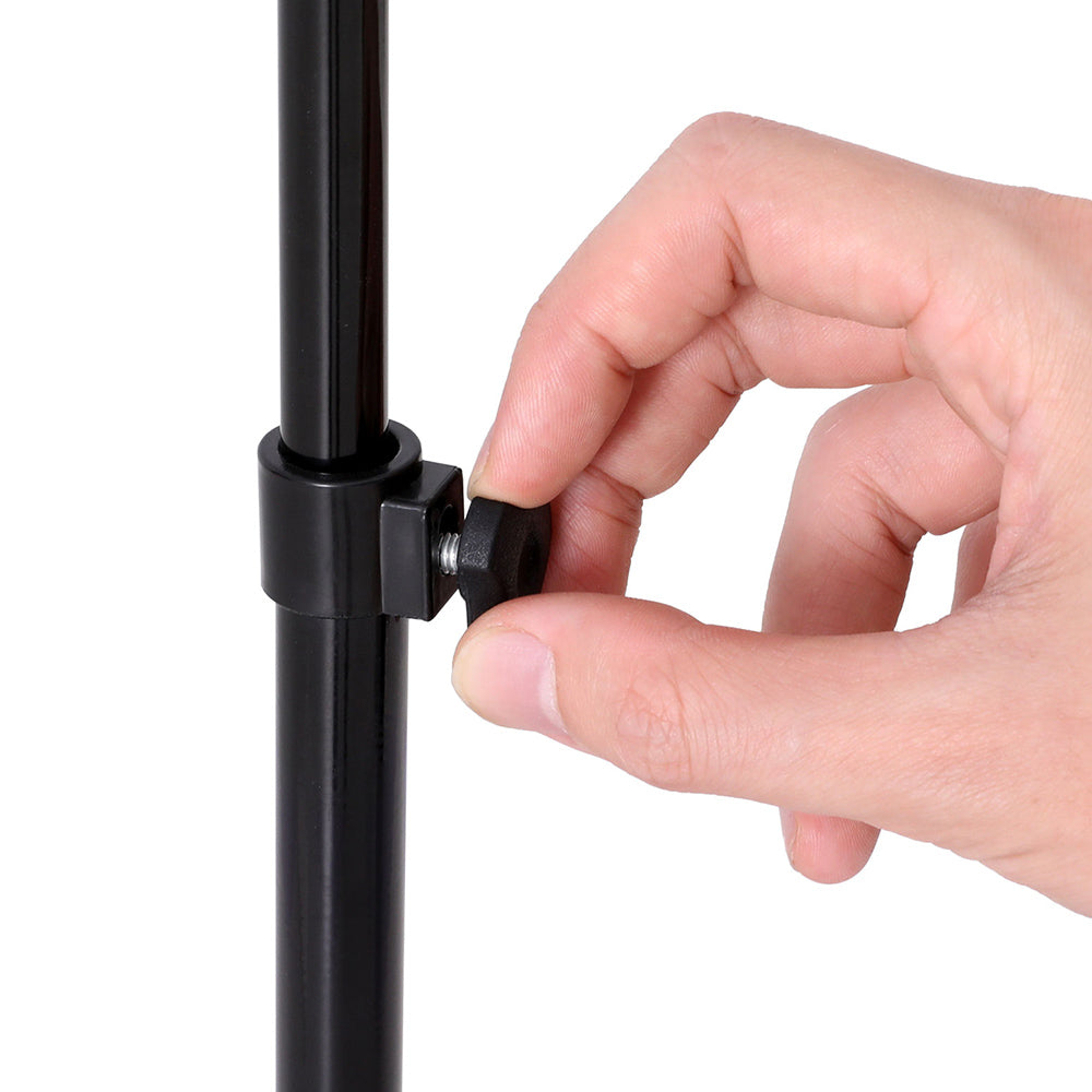 Hand adjusting a black metal stand on a white background