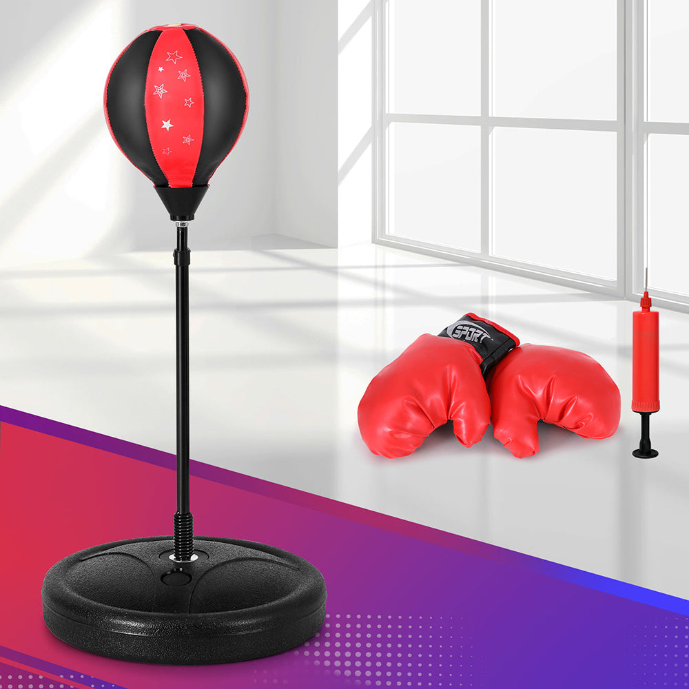 Black and red punching bag with stand and boxing gloves on a colorful floor.