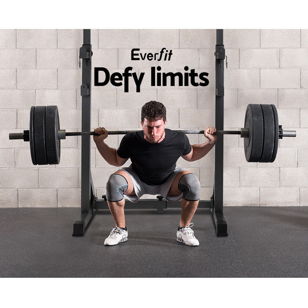 Person performing a squat with weights, with 'Everfit' and 'Defy limits' text in the background.