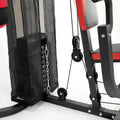 Close-up of a weight lifting machine with pulleys and weights on a white background