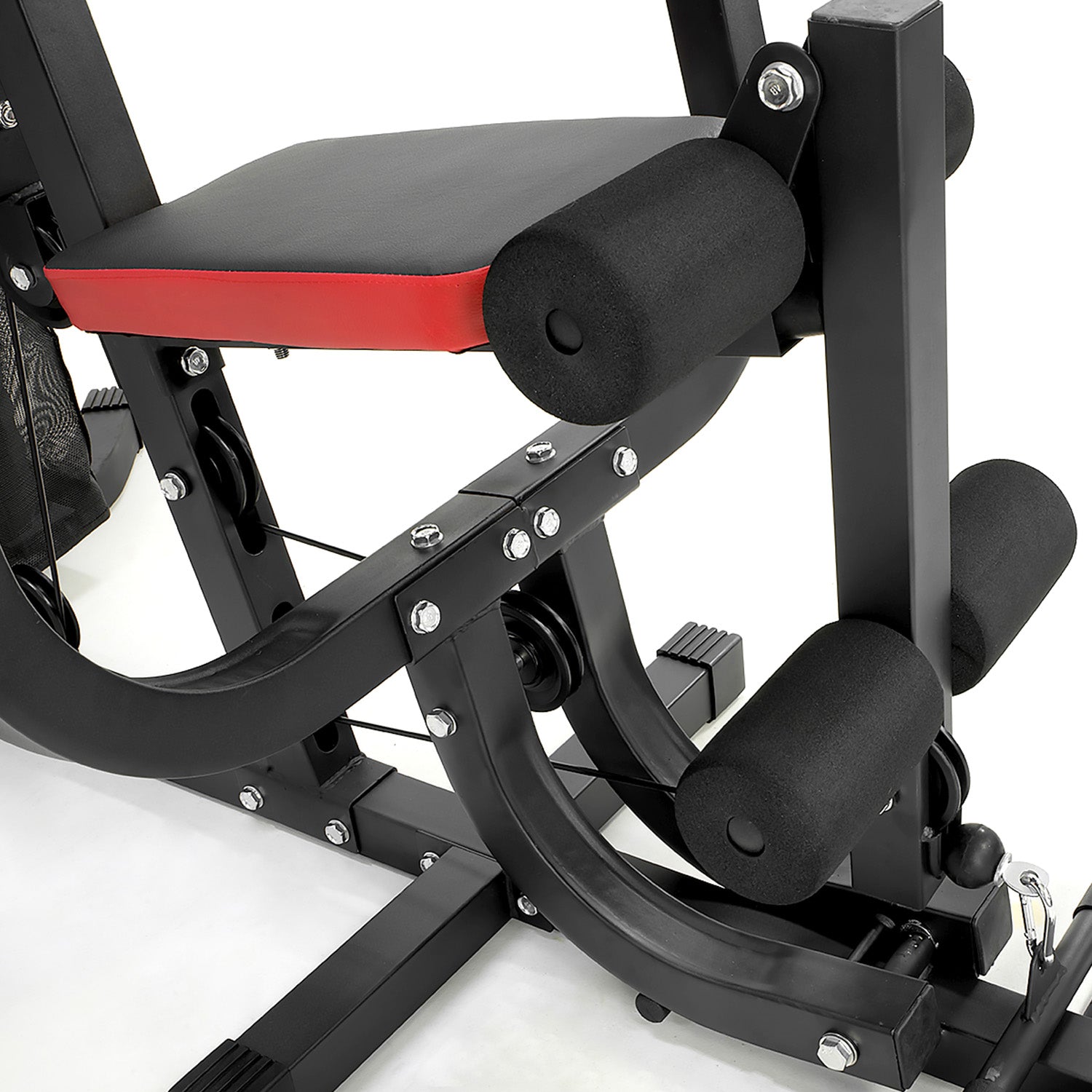 Close-up of a gym machine with black and red design on a white background