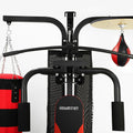 Black and red punching bag stand with hanging bags on a white background