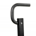 Black metal handlebar with a square base on a white background