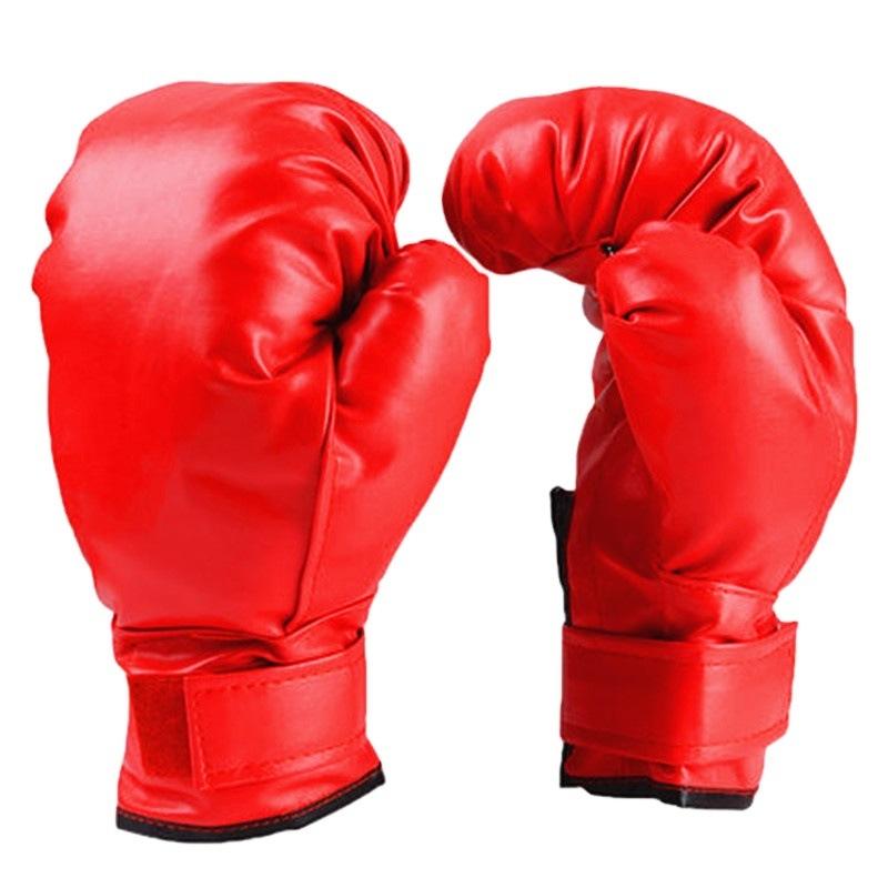 Woman wearing red boxing gloves against a white textured wall