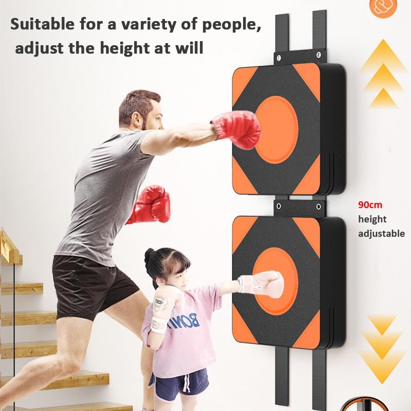 Two people using a adjustable boxing pad on a wall with text indicating adjustability.