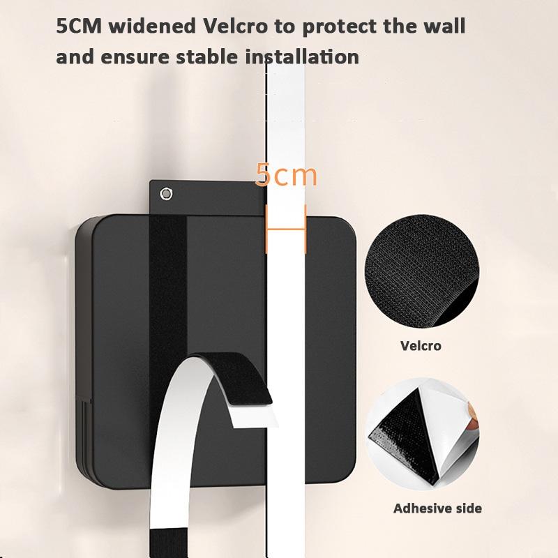 Black wall hook with 5cm widened Velcro for stable installation on a white background.