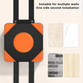 Wall decoration with orange and black design on a neutral background