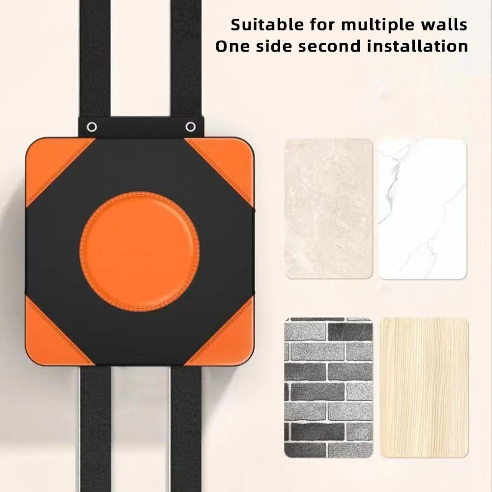 Wall decoration with orange and black design on a neutral background