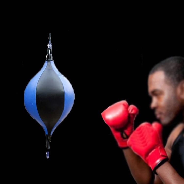 Person wearing red boxing gloves with a blue and black punching bag in the foreground on a black background