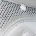 Close-up of a white sneaker with textured mesh and white sole.