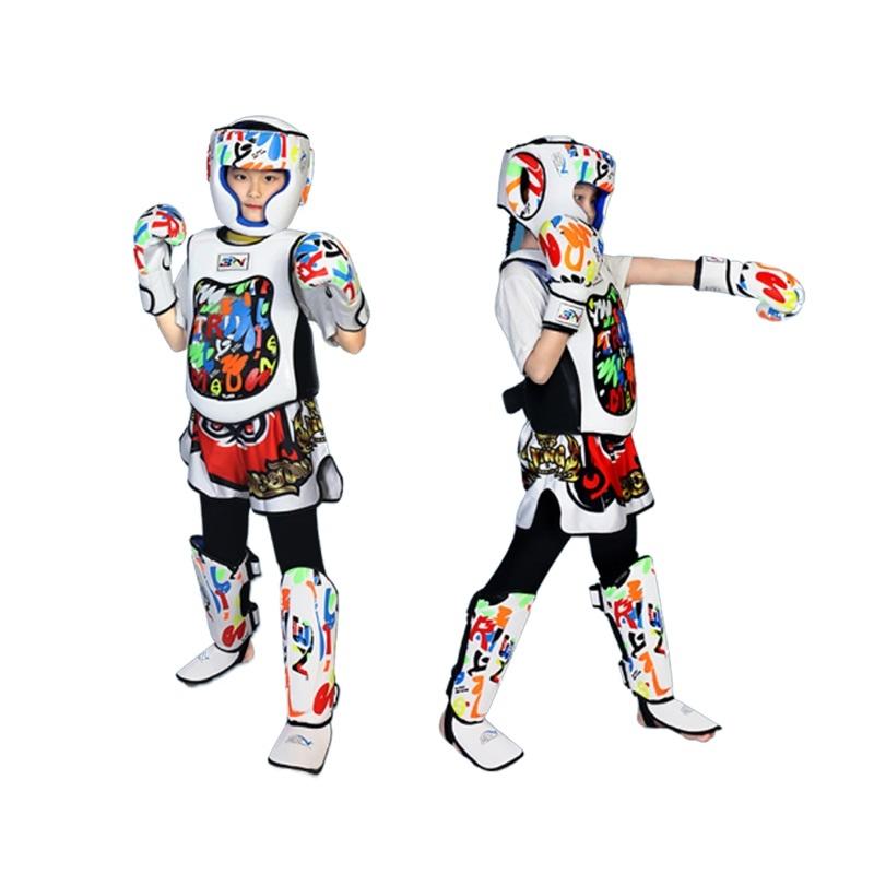 Child wearing a colorful protective sports outfit with helmet, gloves, and shin guards on a white background