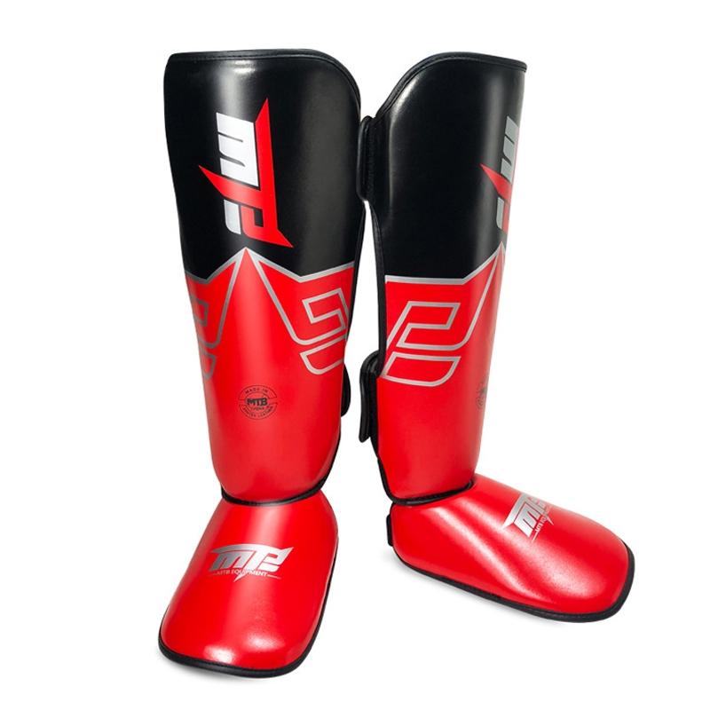 Red and black shin guards with a brand logo on a white background