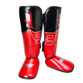 Red and black shin guards with a brand logo on a white background