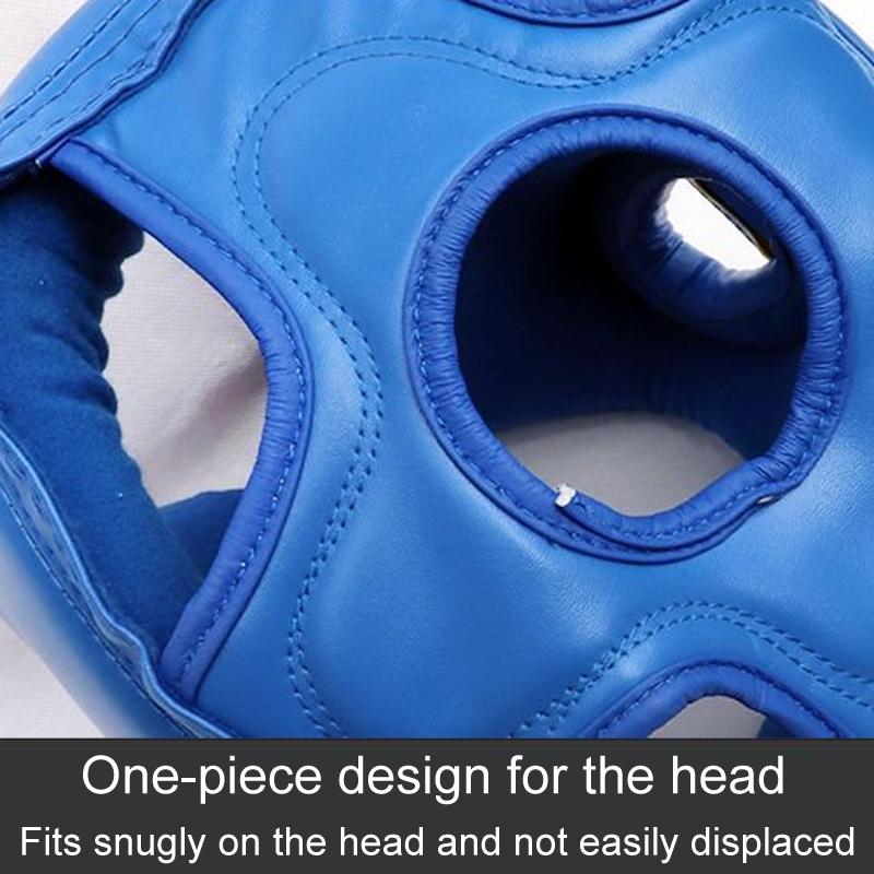 Close-up of a blue boxing headgear with text on a gray background