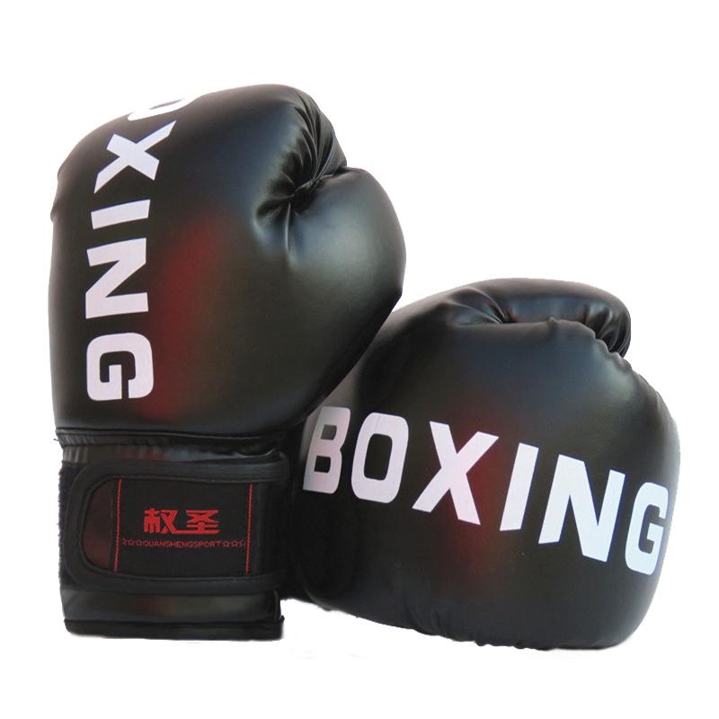Black boxing gloves with 'BOXING' written on them on a white background