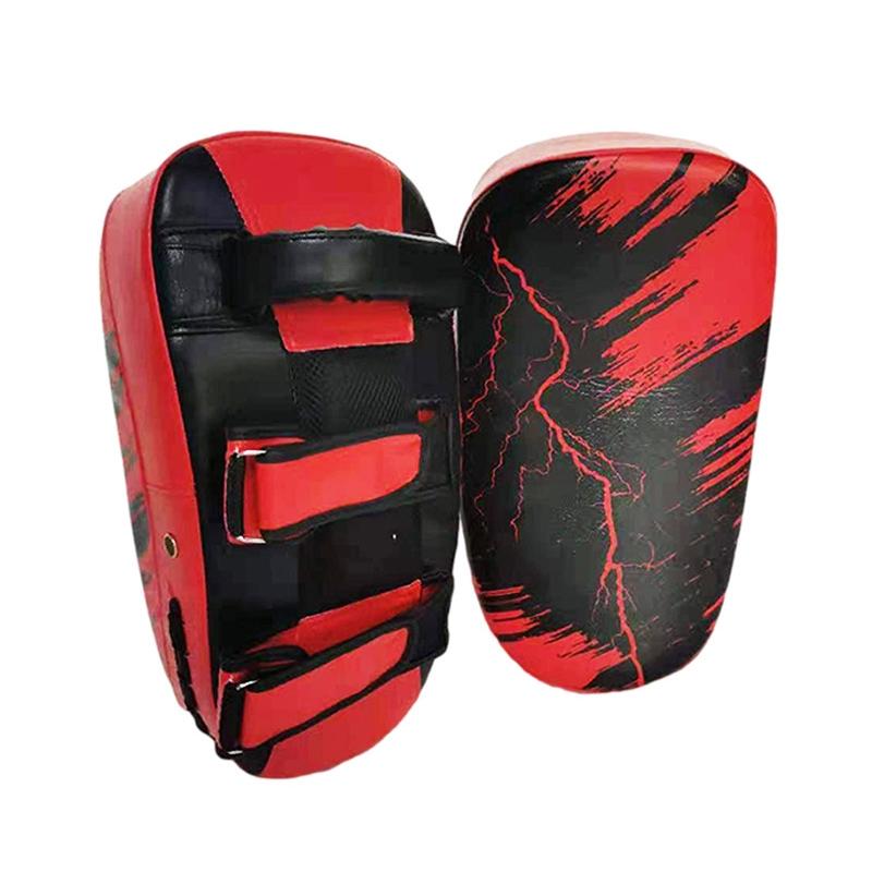 Red and black martial arts training pads on a white background