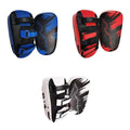 Three pairs of colorful martial arts shin guards on a white background