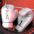 Pair of pink boxing gloves with 'SILVER' branding on a red and black background.