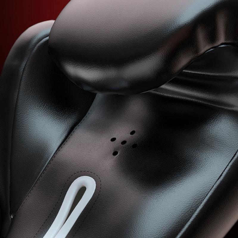Close-up of a black leather seat with a white component