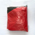 Red and black item wrapped in clear plastic on a white background