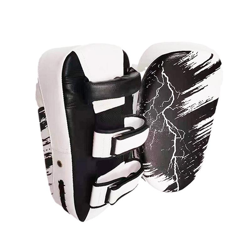 Black and white martial arts training pads with abstract design on a white background