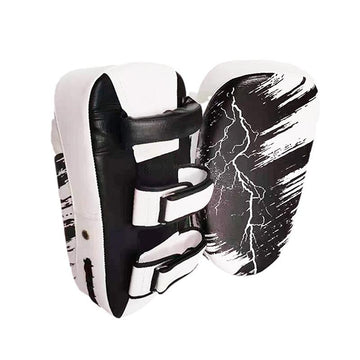 Black and white martial arts training pads with abstract design on a white background