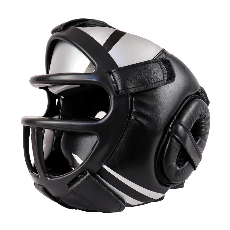 Black and white boxing helmet with face guard on a white background