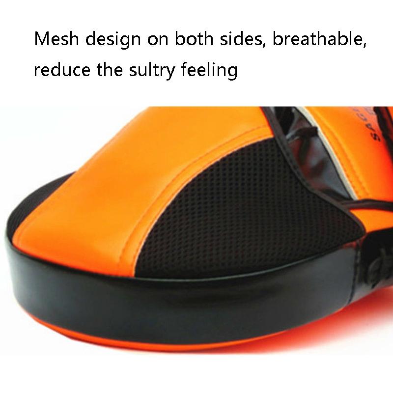 Orange and black shoe with mesh design on a white background