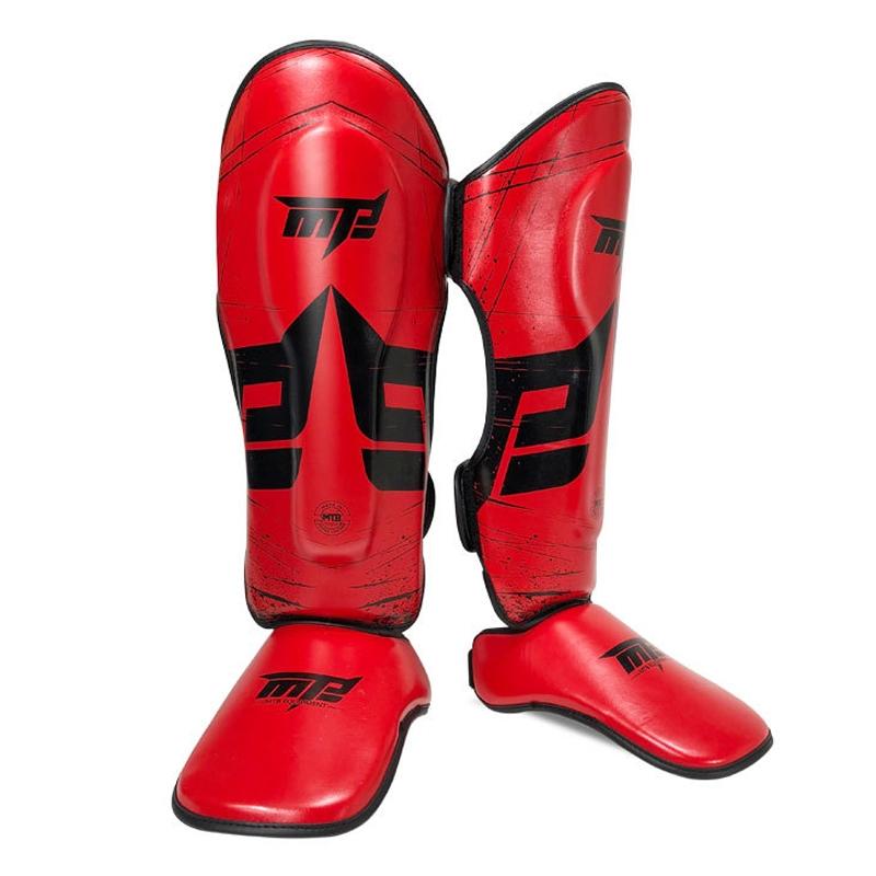 Red martial arts shin guards with black accents on a white background