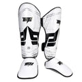 White and black shin guards with a brand logo on a white background