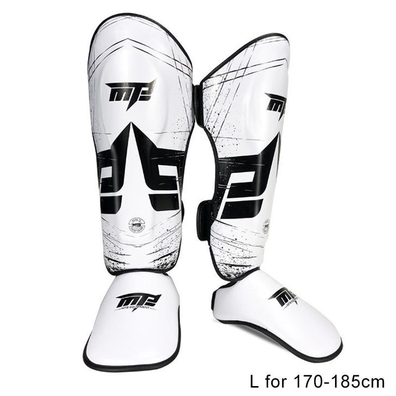 White and black shin guards with visible branding on a white background