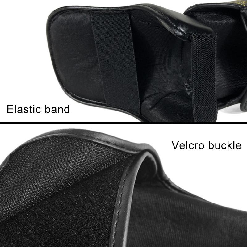 Close-up of a black leather bag with an elastic band and velcro buckle on a white background.