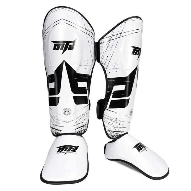 White and black shin guards with a brand logo on a white background