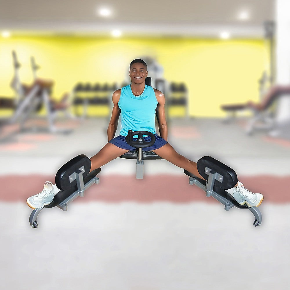 Person using a leg extension machine in a gym setting