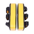 Pair of yellow and black martial arts foot pads on a white background