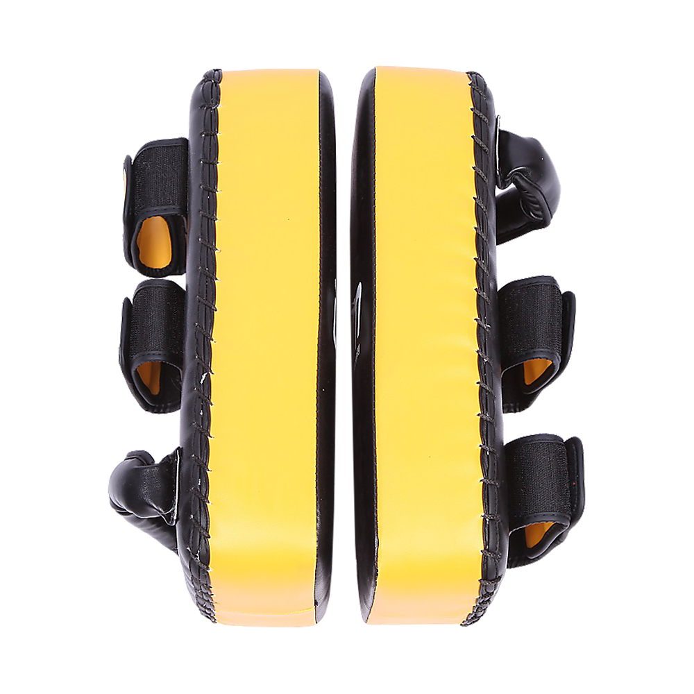 Pair of yellow and black martial arts foot pads on a white background