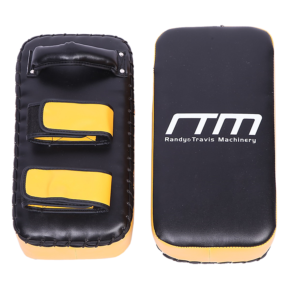 Black and yellow martial arts training pads with 'RTM' branding on a white background