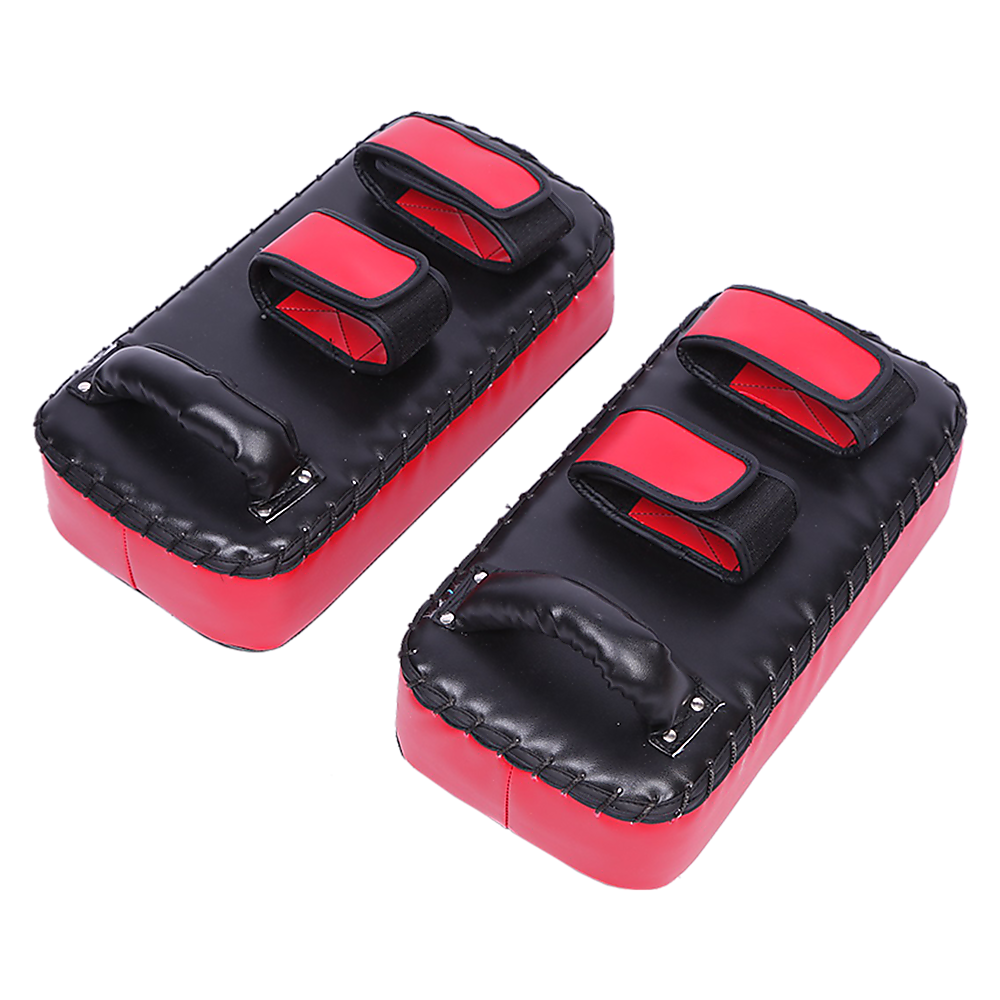 Pair of red and black martial arts knee pads on a white background
