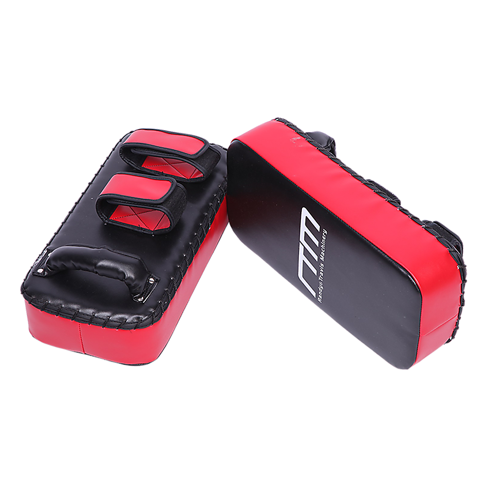 Red and black martial arts training pads on a white background