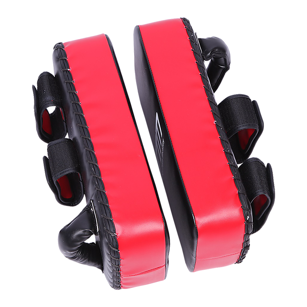 Red and black martial arts training pads on a white background