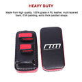 Heavy-duty black and red martial arts training pads with Randy Travis Machinery logo on a white background.