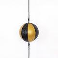 Black and gold punching bag with a rope on a white background